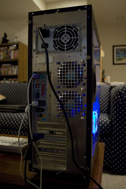 View of the rear of the computer. Note the 2 80mm fans, 10 USB ports, 6 channel audio, etc.
