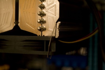 A closeup of the fan bracket, holding a Scythe S-FLEX F 120mm fan in place