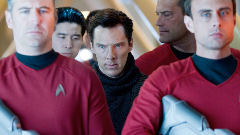 Benedict Cumberbatch guarded by *not enough* red shirts.